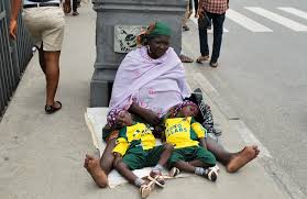 Image result for woman caught with triplets on street begging alms