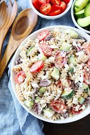 I don't know what it is about a simple pasta salad that makes people so happy, but it never seems to fail. Greek Pasta Salad With Greek Yogurt