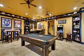 Randy Likes The Shelf At The Ceiling To Display His Helmets And Footballs In The Man Cave Man Cave Home Bar Game Room Game Room Design