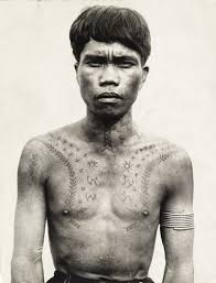 The original process involved making small cuts with bird bone, turtle shell, or. 657274 An Ifugao Tribesman Ornamented With Tattoos And Bicep Bangles Filipino Tattoos Filipino Tribal Tattoos Filipino Tribal