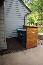 Garbage cans, but is designed with a low profile to sit below a. 23 Awesome Diy Outdoor Eyesore Hiding Ideas To Beautify Your Garden Trash Can Enclosure Outdoor Trash Cans Backyard