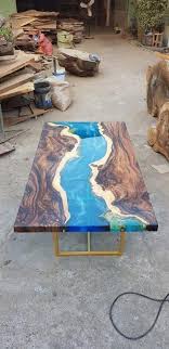 Both of these two substances are liquids, but when mixed they form a solid surface. Blue River Table Top With Epoxy Inlay Senna Siamea Wood Epoxy Table Resin Table Coffee Table Wood Resin Table Diy Resin Table Epoxy Wood Table