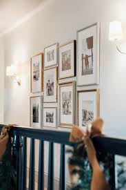 With these simple steps, create a masterpiece look with any combination of framed photos, artwork, heirlooms and other hanging décor. A Family Photo Gallery Wall In The Upstairs Hall Chris Loves Julia