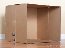 Cut the top of your untreated wooden pole into a triangle so your box can sit on top of it. Turn A Plain Cardboard Box Into A Super Cool Playhouse With This Easy Diy Sheknows