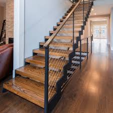 A monochromatic color scheme was used throughout the modern railing interior to reach a balanced look that isn't excessively bold. Cable Railing Custom Stairs Project Gallery Keuka Studios