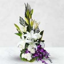 Send flowers to canada to celebrate holidays, birthdays and more. Just Because Arrangement Of 10 White Carnation 10 White Roses 3 Pc White Lilies And 6 Pc Blue Orchids With Fillers And Greens