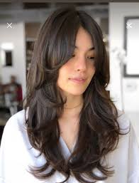 Who can cut long hair with layers and face framing in Seminole?