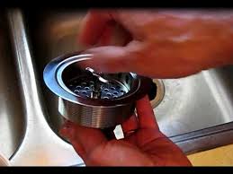 Once the nut is removed, several smaller gaskets and washers will fall down or hang loose around the basket strainer. How To Replace A Sink Strainer Basket Youtube
