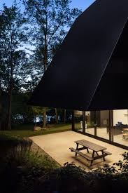Fahouse House Exploits The Contrast Between Opacity And Light Contemporary Cabin Treehouse Living Forest House
