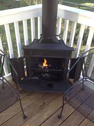 Is a fire pit safe to use on a wooden deck? Franklin Stove On My Deck Outdoor Wood Burning Fireplace Outdoor Wood Outdoor Wood Fireplace