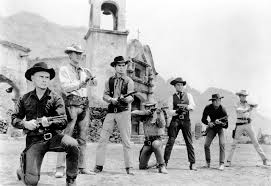 With the town of rose creek under the deadly control of industrialist bartholomew bogue (peter sarsga. File The Magnificent Seven Cast Publicity Photo Jpg Wikimedia Commons