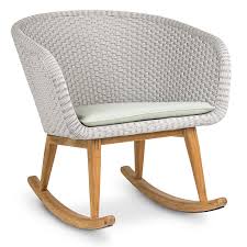 Some strategically placed outdoor rocking chairs would add warmth and a sense of welcoming to your patio. Shell Teak Modern Garden Rocking Chair By Fueradentro