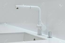 12 excellent kitchen faucets merging utility and style. A New White Kitchen Sink Made Of Artificial Stone And A Faucet Stock Photo Picture And Royalty Free Image Image 93345895