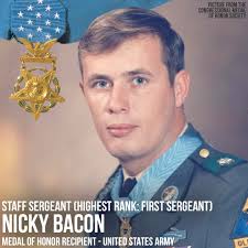 Staff Sergeant Bacon displayed extraordinary heroism while leading his  squad during an operation near Tam Ky. When his company came under heavy  fire, he led an assault