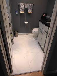 Large tiles look silly in small spaces and small pieces cut along the edges look even worse. 24x24 Tile In Small Bathroom Very Minimal Groutlines Large Tile Bathroom Marble Tile Bathroom Stunning Bathrooms