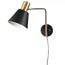 Crafted from metal, it features a round backplate, curved arm, and a wide canopy in the style of a barn light. Adelone Rejuvenation Cylinder 1 Light Plug In Armed Sconce Sconces Swing Arm Lamp Lamp