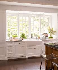 Beautiful White Kitchen With Large Windows Kitchen Trends Kitchen Sink Decor Farmhouse Sink Kitchen