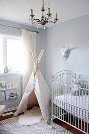 Trending 12 Pastel Baby Nurseries We Re Loving Right Now Grey Baby Nursery Nursery Themes Nursery Trends