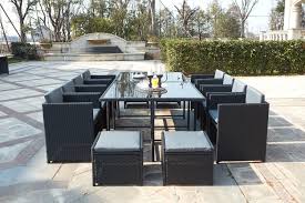 Votre salon de jardin en résine tressée de chez dcb séduit par sa couleur chocolat et sa solution de rangement : Table De Jardin Resine Tressee Encastrable 10 12 Places Miami