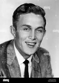 Jimmy Dean, an American country singer, television host, and businessman,  is pictured here in 1958. He is known for his contributions to country  music and his later success in the food industry