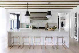 Shiplap kitchen island with stainless steel top and 4 cabinet doors with shelves. Shiplap Island With Quartz Waterfall Countertop Transitional Kitchen