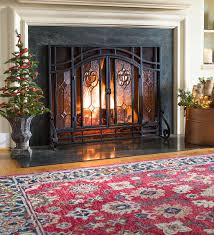 Those that can be opened completely are the best to install as fireplace doors come in a wide variety of styles to make great improvements to the focal points of a room. Two Door Fireplace Screen With Glass Floral Panels Plowhearth