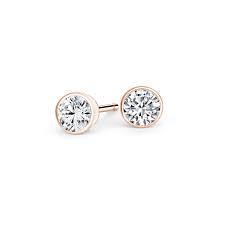 From the modern legacy collection, these fetching women's earring feature lustrous cultured freshwater pearls set in 10k rose gold. Bezel Set Round Diamond Stud Earrings In 14k Rose Gold