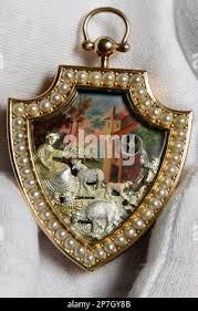 A Sotheby's employee shows an exceptional three color gold Emanel and split  pearl shield form automaton during a preview at Sotheby's in Geneva,  Switzerland, Wednesday, May 5, 2010. It once belonged to the notoriously  extravagant King Farouk, last ...