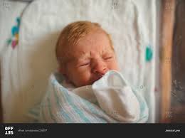 Red hair is a whole different ball game and is classified as an incomplete dominate meaning it's neither dominate or recessive. Close Up Of A Newborn Baby With Red Hair In Hospital Bassinette Stock Photo Offset