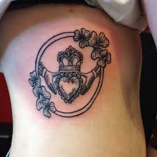 The center is existed in the axis, around both individual hands are clinched, along with a crown illuminates on head of their center. Irish Claddagh Tattoo Designs Shefalitayal