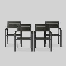 Keep the color of nearby furniture in mind. Bryant 4pk Stack Patio Dining Chair Black Project 62 Target