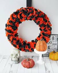 We chose to hang this sign off the bottom of the wreath which really makes it a fairly large display. 49 Diy Halloween Wreaths How To Make Halloween Door Decorations