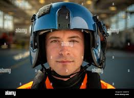 Lt. Patrick johnsen, a pilot stationed at Coast Guard Air Station San  Francisco, stands for a portrait in San Francisco, Calif., March 30, 2021.  When not training or