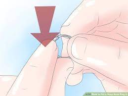 Can you blow your nose with a nose piercing? 3 Ways To Put A Hoop Nose Ring In Nose Rings Hoop Nose Hoop Nose Ring
