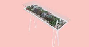 Patio table of reclaimed deck boards and repurposed wood columns. Here S How To Make Your Own Terrarium Coffee Table Diy Terrarium Coffee Table Guide