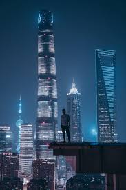 Man Standing On Top Of Skyscraper Skyscraper City Aesthetic Cyberpunk City