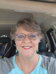 The glare from the light could be a cigarette, I suppose. Or drool.