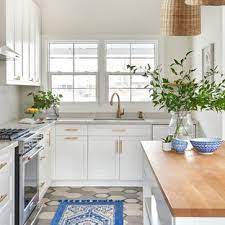 Multihued dishes add another burst of color on open cabinet shelves. Tile Floor With White Cabinets Houzz