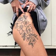 Since it is a skull, it still looks a bit deadly and scary, but all the flowers and hearts and colors make it pretty. Thigh Tattoo Thightattoo Tattoos For Women Floral Thigh Tattoos Flower Thigh Tattoos