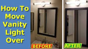 Vanity light fixture with outlet receptacle. How To Move Off Center Vanity Light Over On Bathroom Wall Youtube