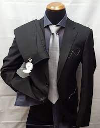 Trova immagini stock hd a tema uomo serio in un completo nero e milioni di altre foto, illustrazioni e contenuti vettoriali stock royalty free nella vasta raccolta di shutterstock. Abito Da Uomo Tinta Unita Nero Factory Basic