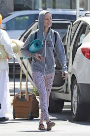brie larson in a gray hoody heads to a