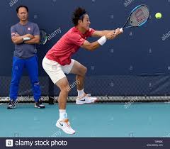 What racquet does kei nishikori play with? Kei Nishikori Tennis Coach Stockfotos Und Bilder Kaufen Alamy