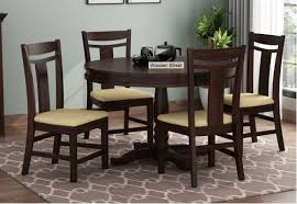 A wicker table set with a glass table top, for example, adds a little transitional charm to the room, while a counter height table with elevated stools is perfect for casual dining. Round Dining Table Buy Round Dining Table Set Online At Low Price In India