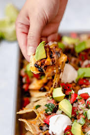 Nachos Layered With A Crisp Tortilla Chips A Simple Seasoned Ground Beef And Black Bean L Best Nacho Recipe Ground Beef Nacho Chips Recipe Nachos Recipe Beef