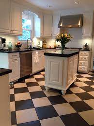 Understanding the quality of construction and materials used can help you to see why! Black And White Kitchen Milky Way Granite Checker Board Floor Gray And Black D Checkered Floor Kitchen White Cabinets Black Countertops Kitchen Counter Decor