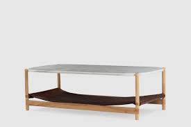 An oval one with an architectural frame functions well as a statement piece, while a square silhouette on a wood base delivers understated appeal. 1 03 Rectangular Coffee Table Ayle