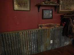 When mounted beneath a chair rail, tin creates a distinctive wainscot. Rustic Corrugated Metal Half Wall Novocom Top
