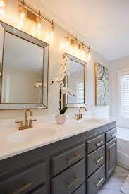 Modern brushed gold finishes like champagne bronze represent the hottest kitchen and bath design trend in 2021. Master Bathroom By Everything Real Estate Champagne Bronze Gold Brushed Chelsea Grey Vanity Mold In Bathroom Bronze Bathroom Faucets White And Bronze Bathroom