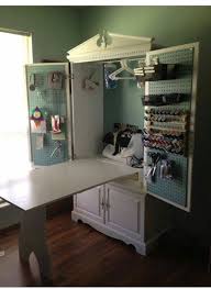 Wardrobe Cabinet Turned Into A Fold Out Crafting Space With A Large Table And Craft Supply Storage Sewing Cabinet Sewing Rooms Craft Room Storage